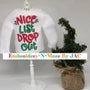 White elf sweater with 'Nice List Drop Out' embroidered in red and green, next to mini Christmas tree.