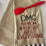 Flour sack towel with embroidered text 'OMG my mom was right about everything' and red spatula