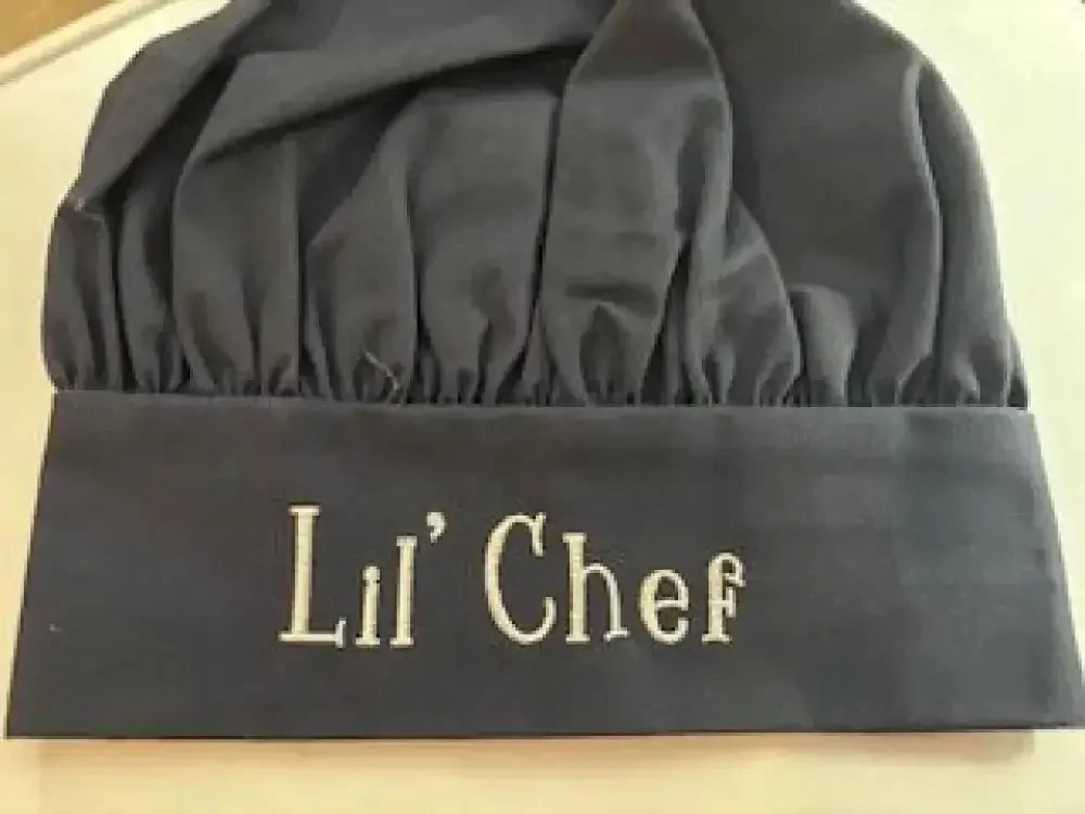 Personalized black child chef hat with Lil' Chef embroidered on the front