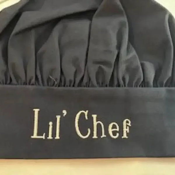 Personalized black child chef hat with Lil' Chef embroidered on the front