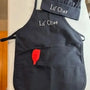 Personalized child apron and chef hat set in black with 'Lil' Chef' embroidery and red spatula