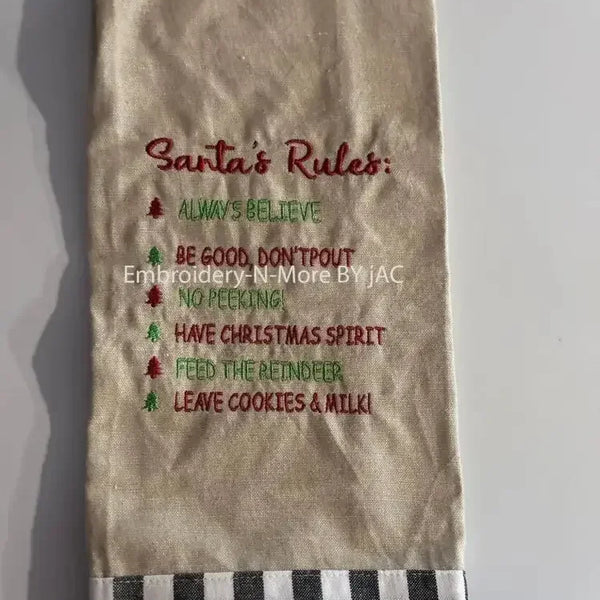 Embroidered Christmas oatmeal hand towel with Santa's Rules and buffalo plaid border