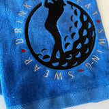 Personalized blue golf towel with embroidered golfer silhouette and 'Swing Swear Drink Repeat' text