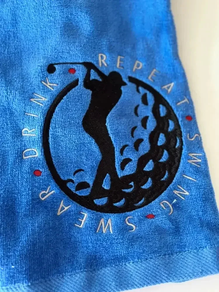 Blue personalized golf towel with embroidered golfer silhouette and Swing Swear Drink Repeat text