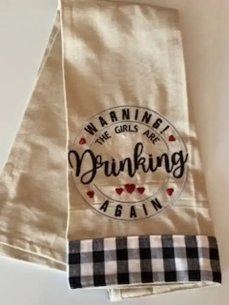 Embroidered kitchen towel with 'Warning! The girls are drinking again' and checkered trim